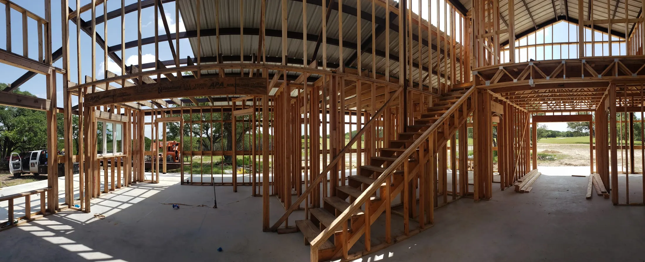 Framing and finish-out work in progress inside a steel-framed home.