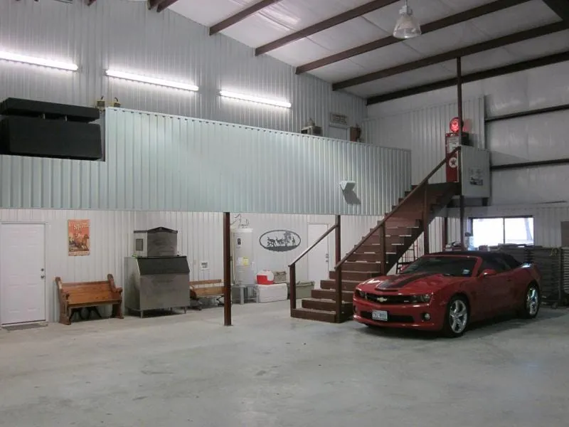 Finished shop interior with mezzanine stair and epoxy floor.