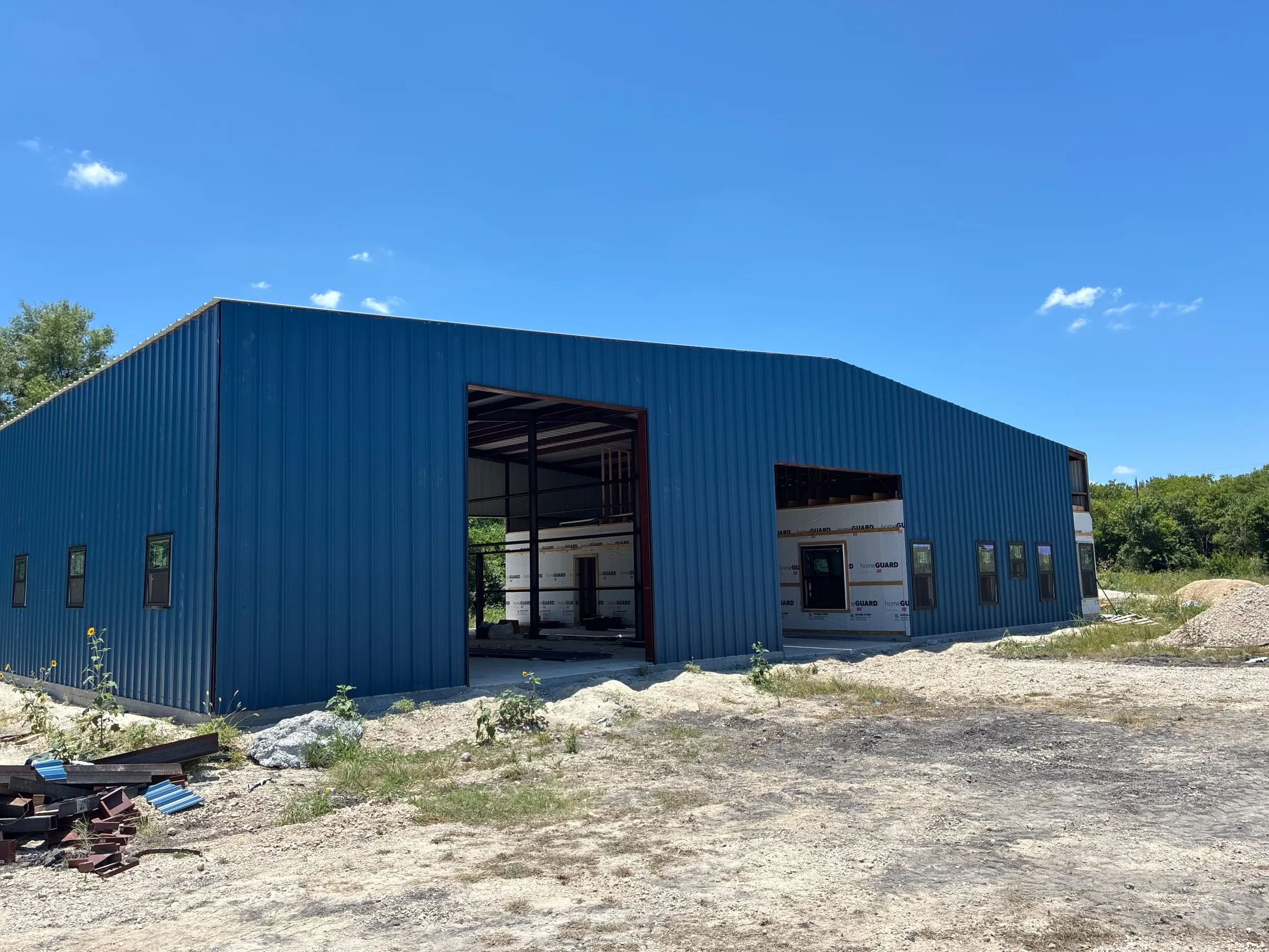 Blue metal exterior enclosing the home and shop structure.