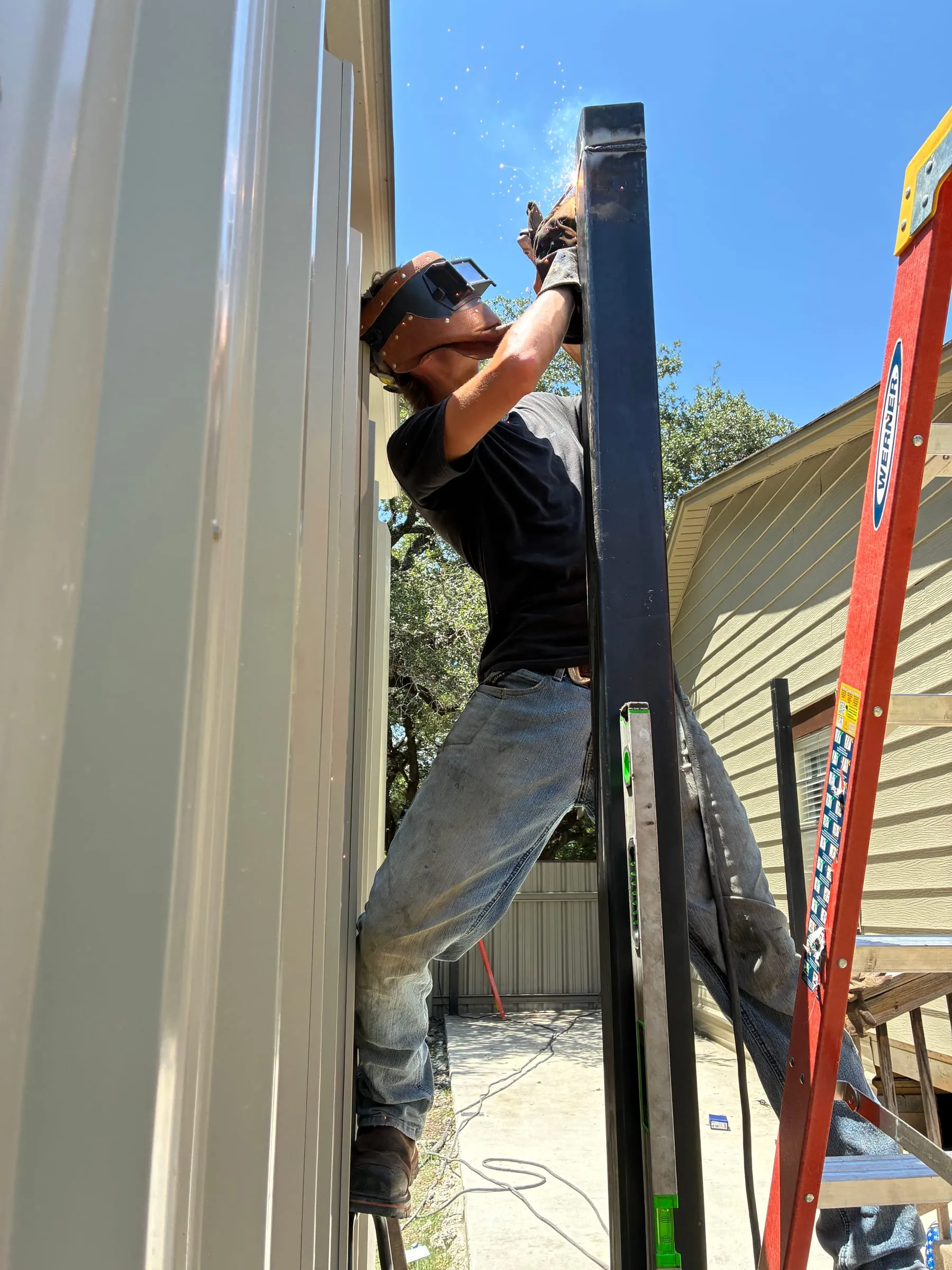 Roof panels going onto the front patio's steel framing.