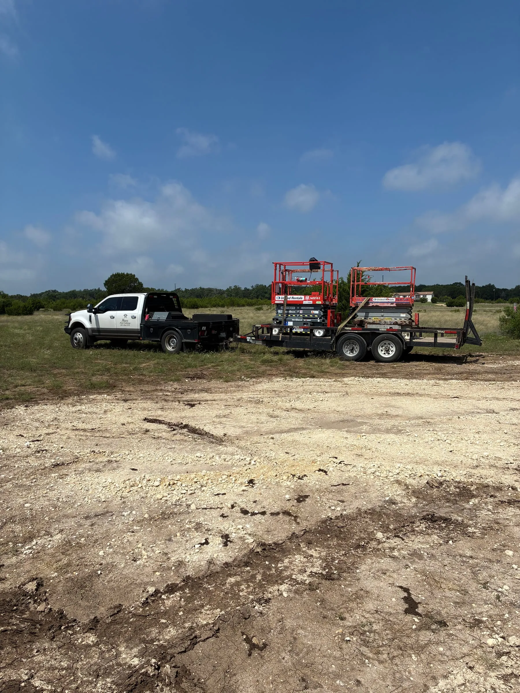 Prepared work area beside the slab during framing operations.