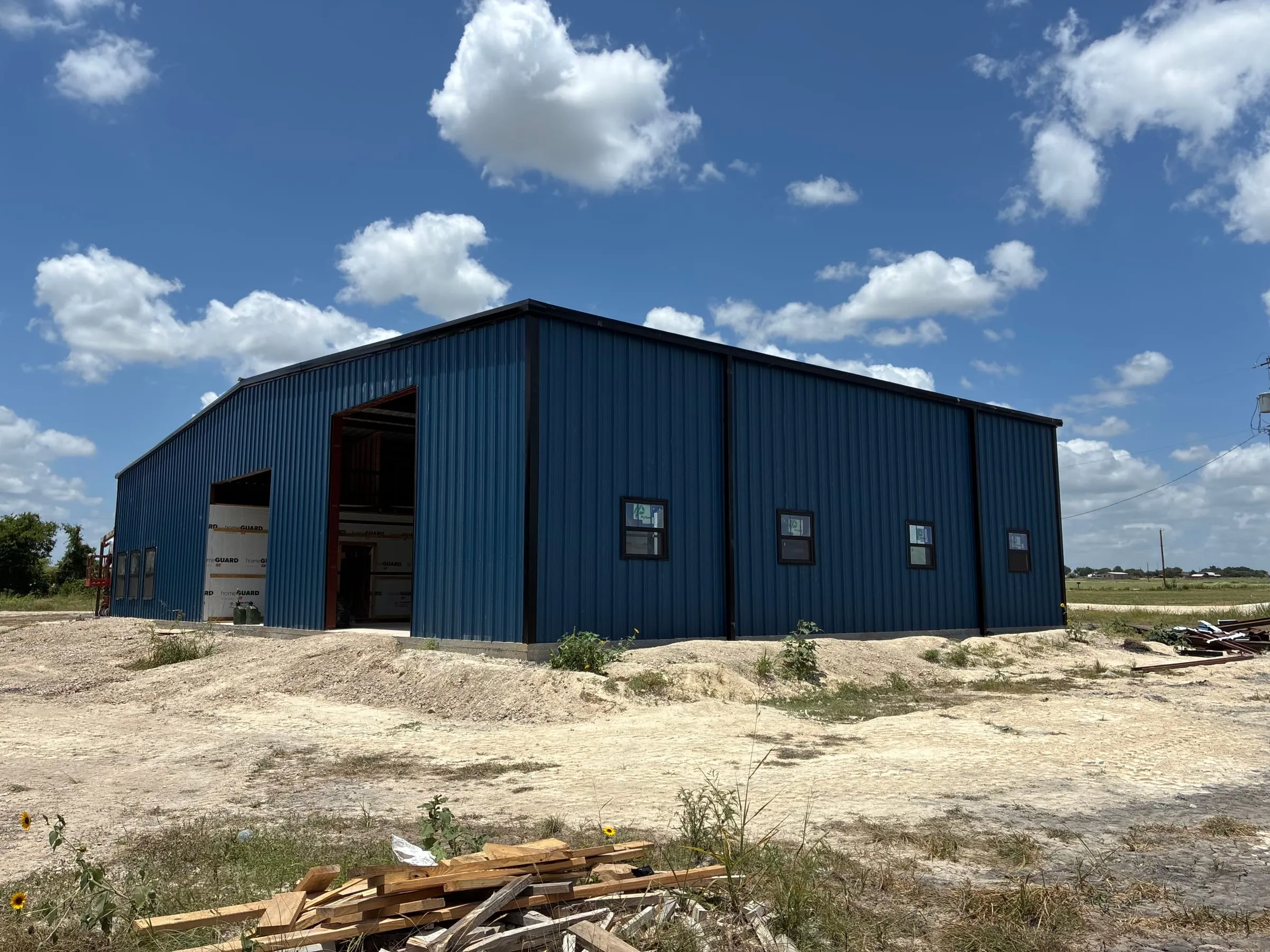 Daniels blue steel home and shop building under construction in Troy.