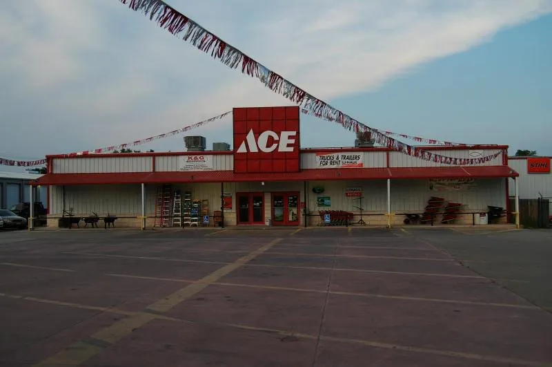 Ace Hardware storefront with metal roofing and covered entry.