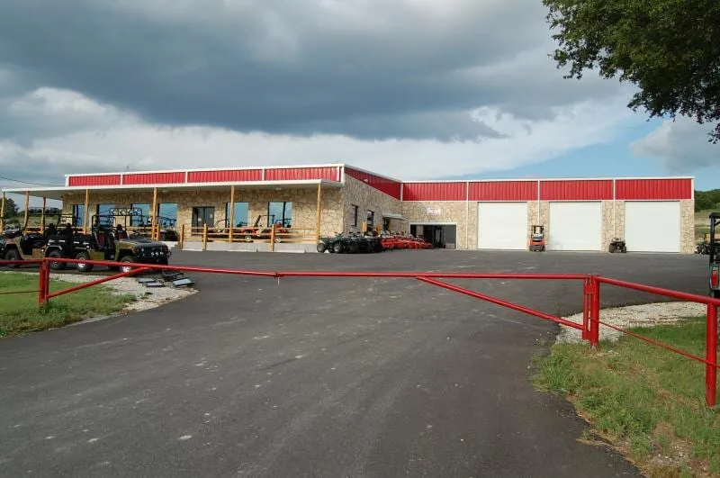Hoffpauir Outdoor Super Store with red trim and stone facade.